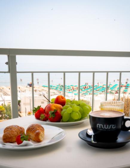 Seaside breakfast with fruit and coffee.